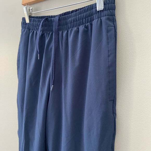 New Balance Navy Blue Taper Fit Drawstring Waist Activewear Back Split Hem Pants - Picture 3 of 5